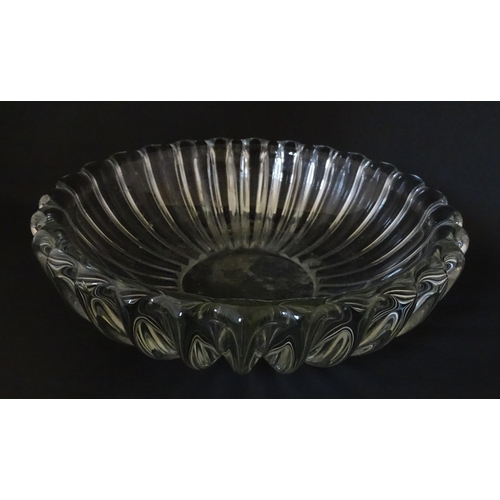 292 - A glass bowl of lobed form in the manner of Pierre d'Avesn. Approx. 11