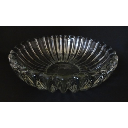 292 - A glass bowl of lobed form in the manner of Pierre d'Avesn. Approx. 11