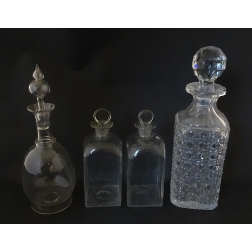 297 - A quantity of assorted Georgian and later decanters, flasks, carafe, etc. To include one with etched... 