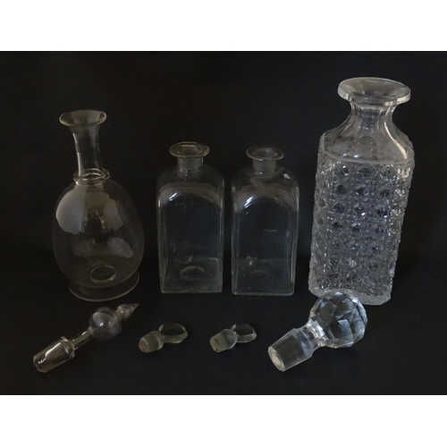 297 - A quantity of assorted Georgian and later decanters, flasks, carafe, etc. To include one with etched... 