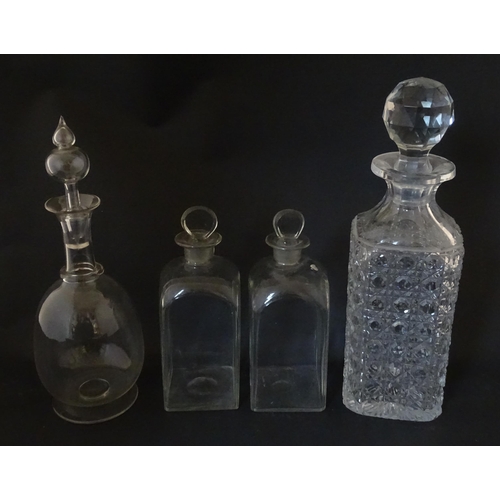 297 - A quantity of assorted Georgian and later decanters, flasks, carafe, etc. To include one with etched... 