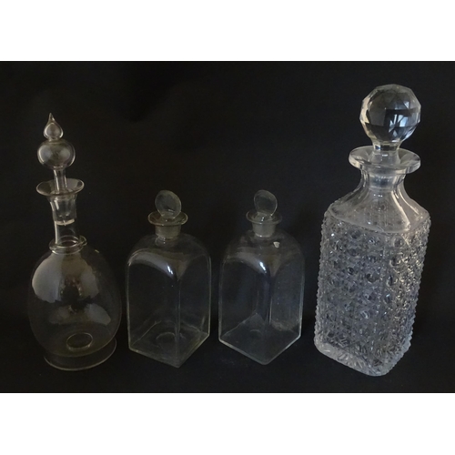 297 - A quantity of assorted Georgian and later decanters, flasks, carafe, etc. To include one with etched... 