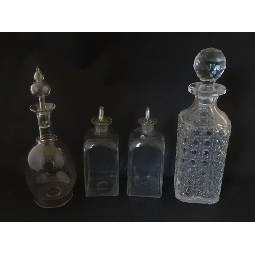 297 - A quantity of assorted Georgian and later decanters, flasks, carafe, etc. To include one with etched... 