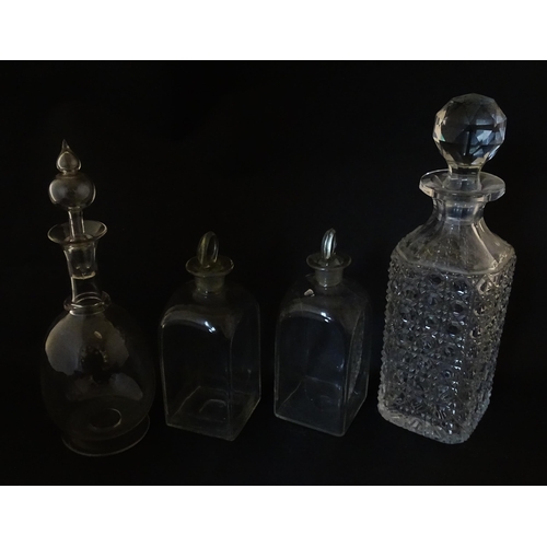 297 - A quantity of assorted Georgian and later decanters, flasks, carafe, etc. To include one with etched... 