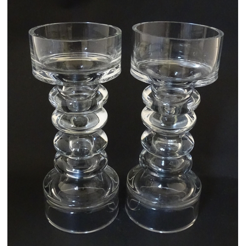 310 - A matched pair of glass candle holders of pillar form. In the Scandinavian style. Approx. 9 3/4