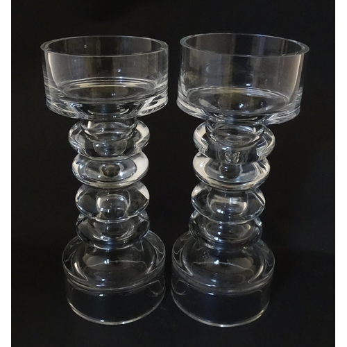 310 - A matched pair of glass candle holders of pillar form. In the Scandinavian style. Approx. 9 3/4