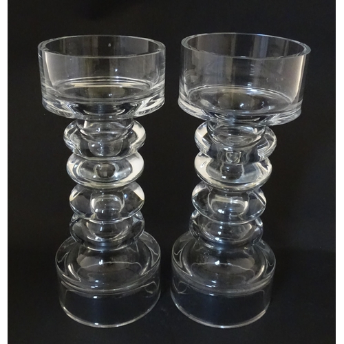 310 - A matched pair of glass candle holders of pillar form. In the Scandinavian style. Approx. 9 3/4