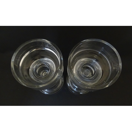 310 - A matched pair of glass candle holders of pillar form. In the Scandinavian style. Approx. 9 3/4