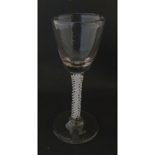 311 - A Georgian drinking glass with air twist stem. Approx. 5 1/4