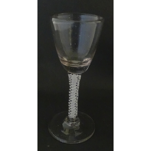 311 - A Georgian drinking glass with air twist stem. Approx. 5 1/4