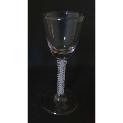 311 - A Georgian drinking glass with air twist stem. Approx. 5 1/4