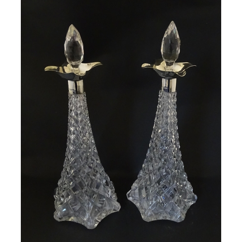 315 - A pair of cut crystal decanters hallmarked London 1911, maker Elkington & Co. Approx. 15 1/2