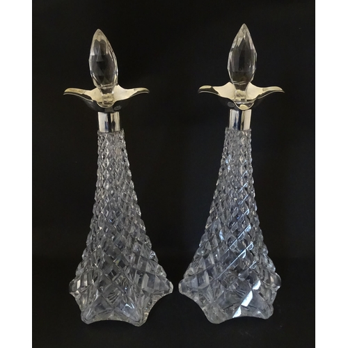 315 - A pair of cut crystal decanters hallmarked London 1911, maker Elkington & Co. Approx. 15 1/2