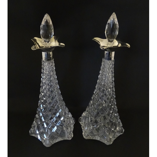 315 - A pair of cut crystal decanters hallmarked London 1911, maker Elkington & Co. Approx. 15 1/2