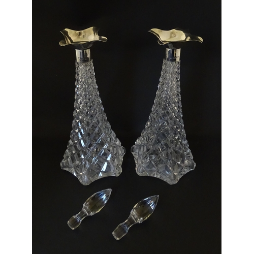 315 - A pair of cut crystal decanters hallmarked London 1911, maker Elkington & Co. Approx. 15 1/2