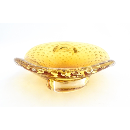 324 - Two Whitefriars controlled bubble ashtrays. Together with a Murano style amber glass bowl with contr... 