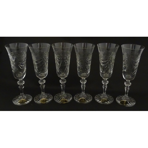 337 - A boxed set of six Veritable Cristal champagne flutes, each with hobnail and swag decoration, signed... 