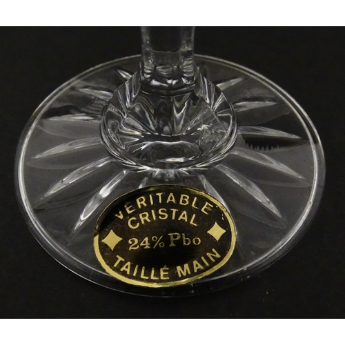 337 - A boxed set of six Veritable Cristal champagne flutes, each with hobnail and swag decoration, signed... 