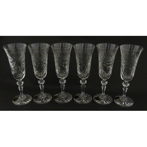 337 - A boxed set of six Veritable Cristal champagne flutes, each with hobnail and swag decoration, signed... 