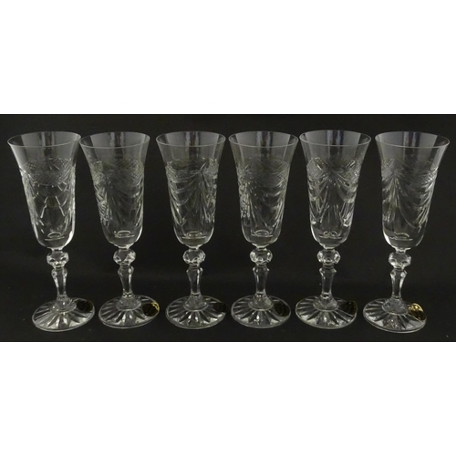 337 - A boxed set of six Veritable Cristal champagne flutes, each with hobnail and swag decoration, signed... 