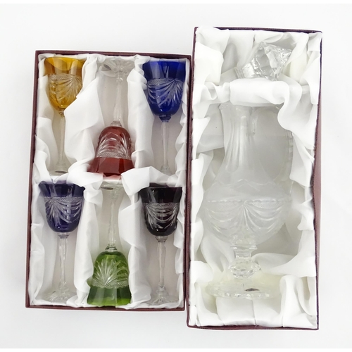 338 - A boxed set of six coloured wine glasses / hock glasses, each with hobnail and swag decoration, sign... 