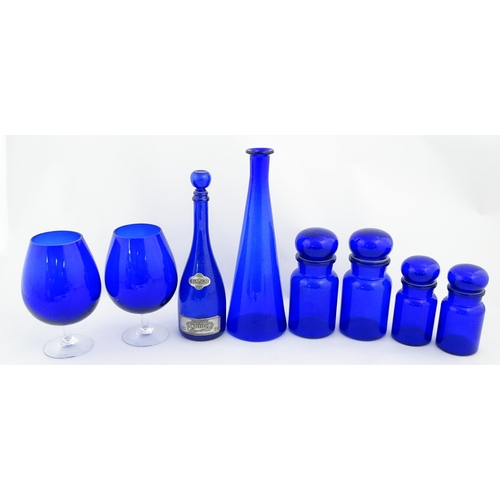 341 - A quantity of Bristol blue style glassware to include flasks, jars, oversized glasses, etc. Largest ... 