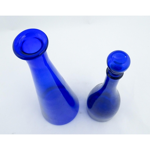 341 - A quantity of Bristol blue style glassware to include flasks, jars, oversized glasses, etc. Largest ... 