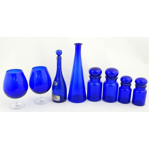 341 - A quantity of Bristol blue style glassware to include flasks, jars, oversized glasses, etc. Largest ... 