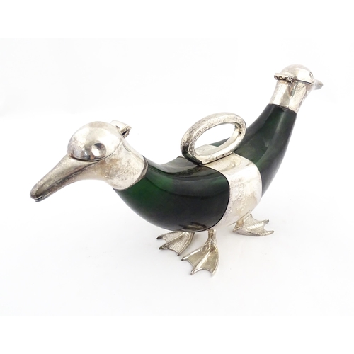 343 - A late 20thC novelty decanter / claret jug formed as a twin headed duck, the green glass body with s... 