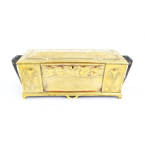 1200 - A WMF Art Nouveau brass casket / box with twin handles and hinged lid, decorated with four embossed ... 