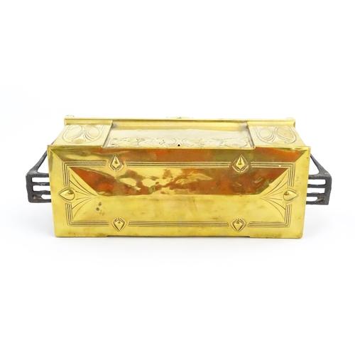 1200 - A WMF Art Nouveau brass casket / box with twin handles and hinged lid, decorated with four embossed ... 