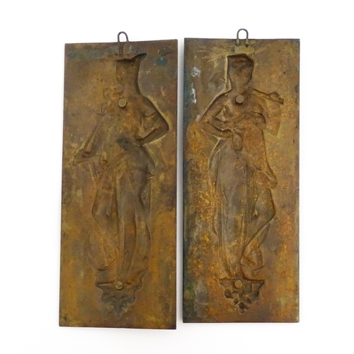 1204 - A pair of late 19thC cast plaques depicting goddesses, to include one with a winged helmet, caduceus... 