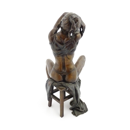 1206 - A bronze sculpture by Benson Landes (1927-2013) depicting a seated lady undressing on a stool. Signe... 