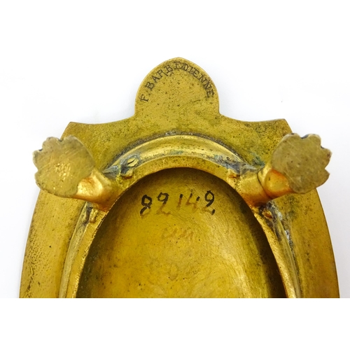 1210 - A 19thC French gilt brass dish / stand of shaped form raised on four lion paw feet, decorated with l... 