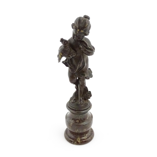 1211 - A late 19th / early 20thC bronze sculpture modelled as a young girl holding a cockatoo bird, raised ... 