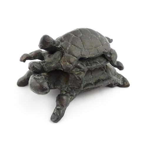 1215 - A 20thC cast sculpture, Travelling Turtles, modelled as three turtles. Approx. 3