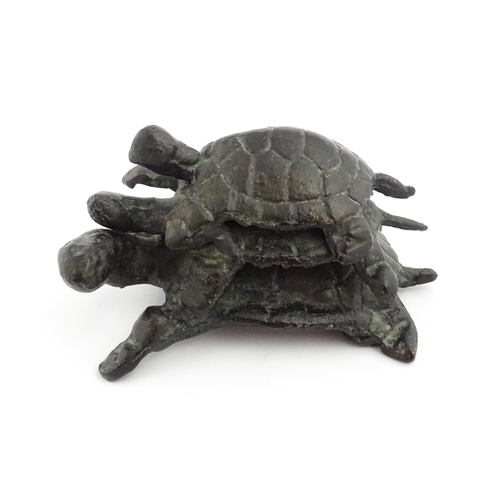 1215 - A 20thC cast sculpture, Travelling Turtles, modelled as three turtles. Approx. 3