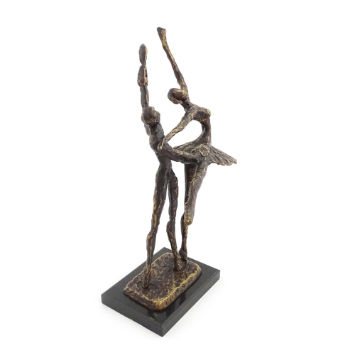 1221 - A 20thC cast modernist sculpture modelled as a couple dancing. Together with a cast bronze model of ... 