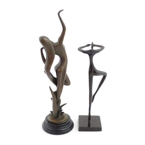 1222 - A 20thC cast sculpture modelled as an abstract female nude. Together with a modernist sculpture mode... 