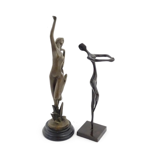 1222 - A 20thC cast sculpture modelled as an abstract female nude. Together with a modernist sculpture mode... 