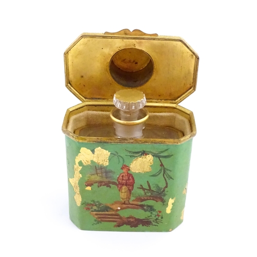 1224 - An early 20thC French glass perfume flask / scent bottle with gilt highlights, with gilt metal trave... 