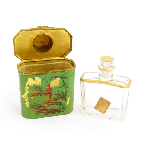 1224 - An early 20thC French glass perfume flask / scent bottle with gilt highlights, with gilt metal trave... 