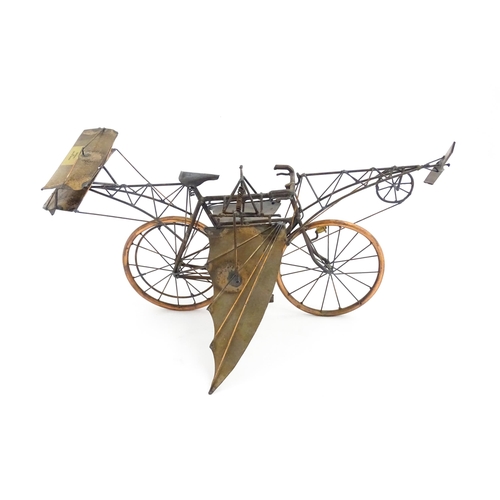 1308 - A 20thC metal model of a bicycle flying machine by David Whipp. Approx. 19