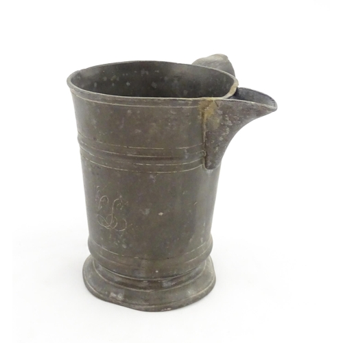 1309 - A 19thC pewter quart tankard with pouring spout, the base inscribed 'New Falcon Gravesend', together... 