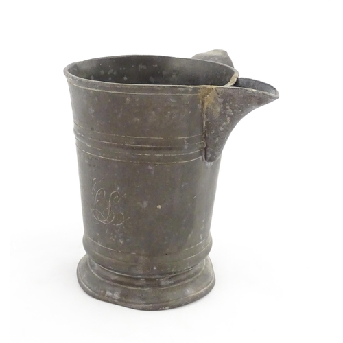 1309 - A 19thC pewter quart tankard with pouring spout, the base inscribed 'New Falcon Gravesend', together... 