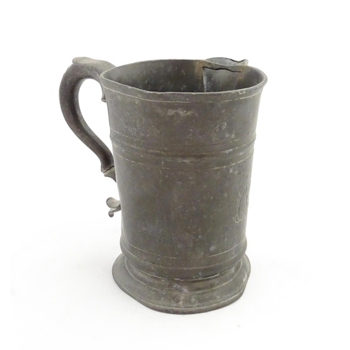 1309 - A 19thC pewter quart tankard with pouring spout, the base inscribed 'New Falcon Gravesend', together... 