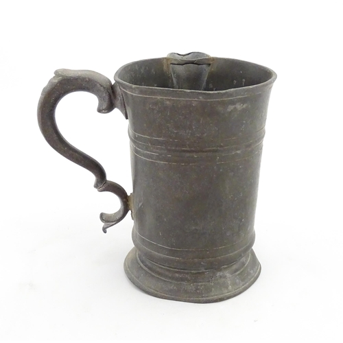 1309 - A 19thC pewter quart tankard with pouring spout, the base inscribed 'New Falcon Gravesend', together... 