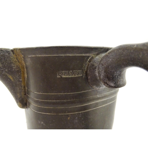 1309 - A 19thC pewter quart tankard with pouring spout, the base inscribed 'New Falcon Gravesend', together... 