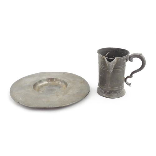 1309 - A 19thC pewter quart tankard with pouring spout, the base inscribed 'New Falcon Gravesend', together... 