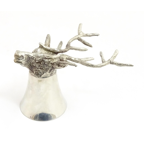 1312 - A 20thC novelty stirrup cup of tapering form modelled as a stag head with antler supports. Approx. 3... 